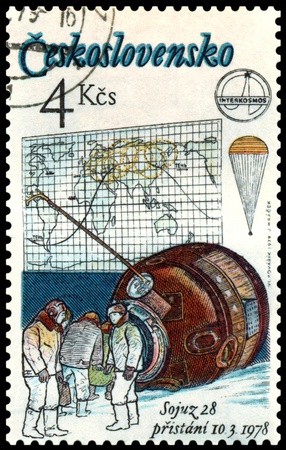 CZECHOSLOVAKIA - CIRCA 1978: A post stamp printed in  Czechoslovakia  shows  Soyuz 28.  Capsule and  astronauts. Circa 1978の写真素材