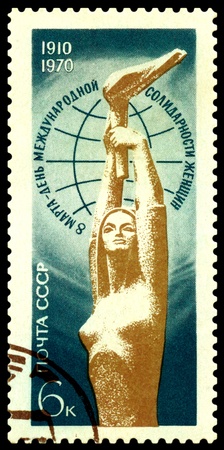  USSR - CIRCA 1970: a stamp printed by USSR shows woman with a torch - a symbol of March 8 - International Women's Day of Solidarity, circa 1970の写真素材