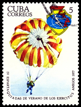 CUBA- CIRCA 1977: a stamp printed by  Cuba, shows  Paratrooper, 4th Military Spartakiad, series, circa 1977の写真素材
