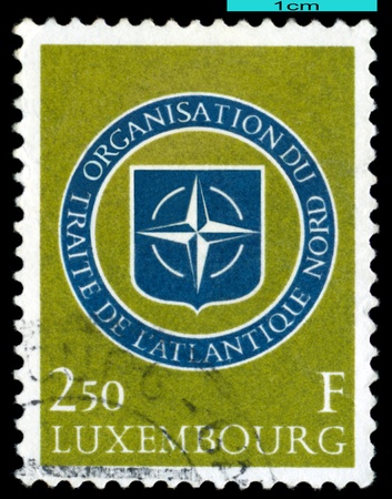 LUXEMBOURG - CIRCA 1959   A stamp printed in Luxembourg,  shows  Emblem NATO, circa 1959のeditorial素材