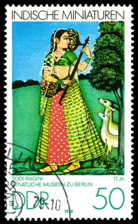 GDR - CIRCA 1979   A stamp printed in GDR  shows Indian Miniatures, Todi Ragini 17th cent , Berlin Museum,  series, circa 1979 のeditorial素材