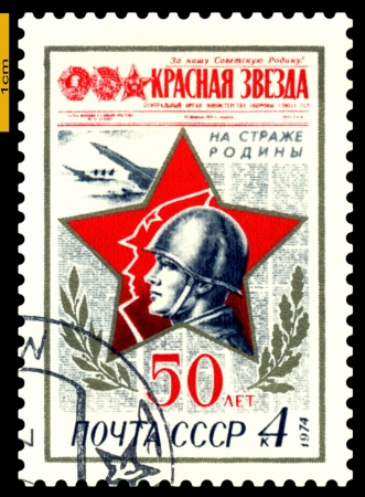 RUSSIA - CIRCA 1974: A stamp printed in USSR, shows Red Star Newspaper, Soldier.  50th anniversary Red Star Newspaper , circa 1974のeditorial素材