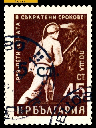BULGARIA - CIRCA 1959: a stamp printed in Bulgaria shows Miner,  circa 1959のeditorial素材