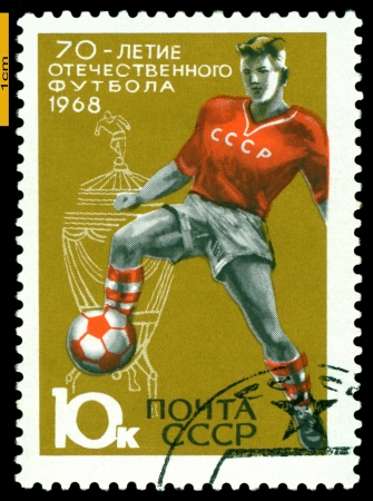 USSR - CIRCA 1968: a stamp printed by USSR shows  Soccer player and Cup, European youth sports competitions, circa 1968のeditorial素材