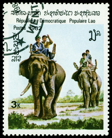 Laos - CIRCA 1982: A stamp printed in Laos shows image of an asiatic elephant, series, circa 1982の写真素材