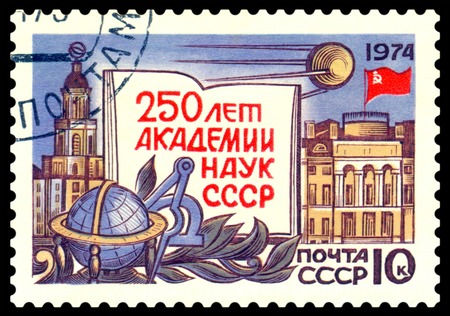 RUSSIA- CIRCA 1974  a stamp printed by Russia, shows symbols and Emblem Academy of the sciences, 250th anniversary, circa1974の写真素材