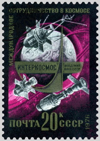 USSR - CIRCA 1976  a stamp printed by USSR  shows  satellite and orbital station    International partnership in space,  series, circa 1976 のeditorial素材