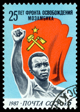 USSR- CIRCA 1987  a stamp printed by USSR, shows  Flag and man ,  25 years of the Front of the Liberation, circa 1987 のeditorial素材