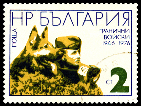 BULGARIA - CIRCA 1976: A Stamp printed in the Bulgaria  shows  Frontier Guard and German Shepherd, circa 1976のeditorial素材