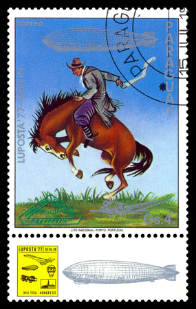 STAVROPOL, RUSSIA - September 12, 2017: a stamp printed by Paraguay shows Tamer of wild horses, International air mail mailのeditorial素材