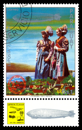 STAVROPOL, RUSSIA - September 12, 2017: a stamp printed by Paraguay shows German Girls in Traditional Costumes, International air mail mailのeditorial素材