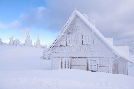 Hut in mountains with blue skyの写真素材