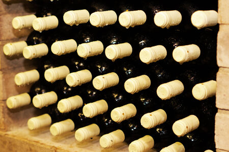 detail of wine bottles with red wine insideの写真素材