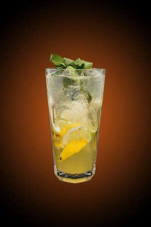 Classic lemonade isolated on brown gradient. Refreshing drinkの写真素材
