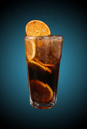 Long island iced tea isolated on blue gradient. Refreshing drinkの写真素材