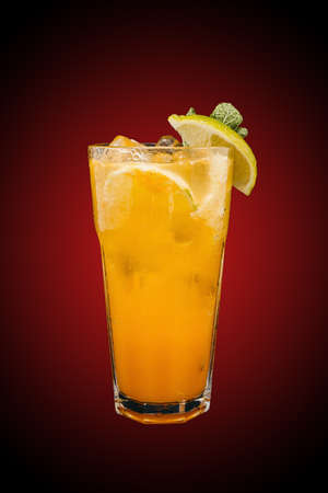 Tropic chill lemonade isolated on red gradient. Refreshing drinkの写真素材