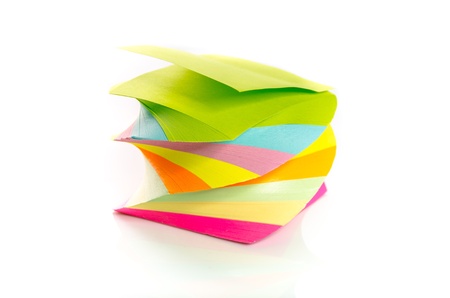 Pile of colorful post-it notes stacked on a spiral isolated on white background