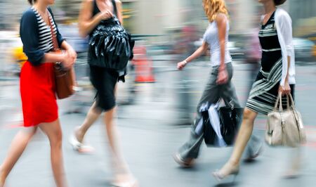 people shopping in the city in motion blurの写真素材