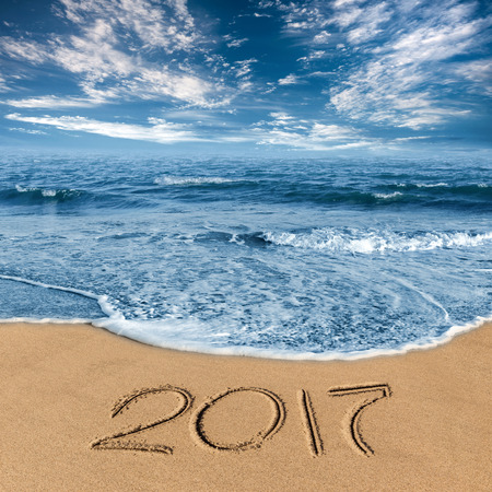 the inscription on the sand 2017 on the beachの写真素材