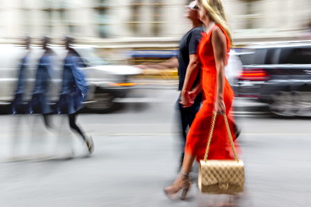 people shopping in the city in motion blurの写真素材