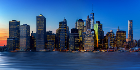 Panoramic view New York City Manhattan downtown skyline at night with skyscrapersの写真素材