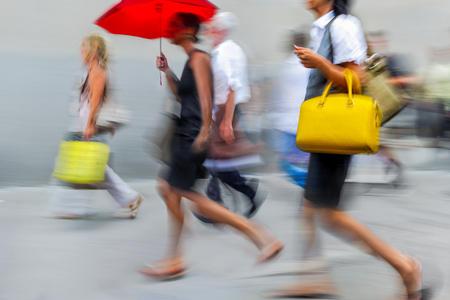 people shopping in the city in motion blurの写真素材
