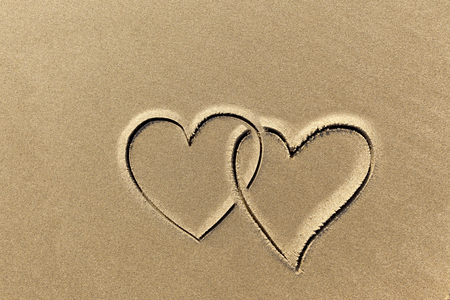 images of hearts in the sand beach coastline close-upの写真素材