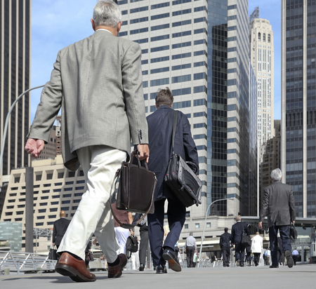 business people at rush hour walking in the streetのeditorial素材