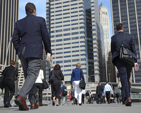 business people at rush hour walking in the streetのeditorial素材