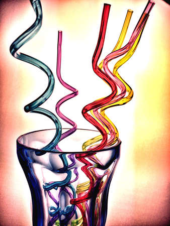 Colorful and funny straws in a blue glassの素材