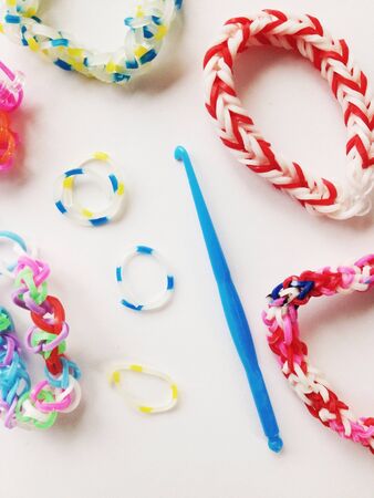 Close view of rubber bracelets and blue hookの素材