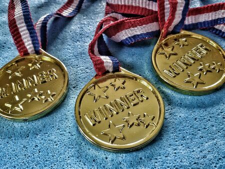 Closeup view of three medals with winner  wordの素材