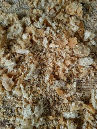 Closeup view of bread crumbs on chopping boardの素材