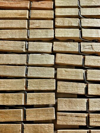 Close view of grouped wood pegsの素材