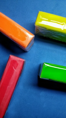 Close view of four colorful bars of clayの素材