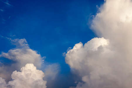 Fantastic soft white clouds against blue skyの写真素材