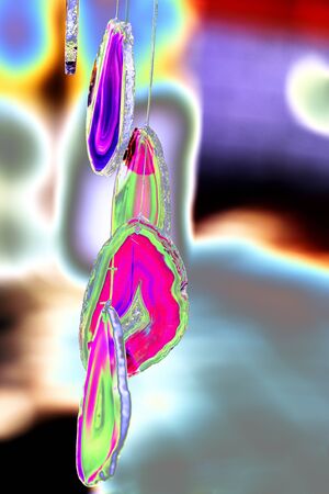 multicolor abstract stones hanging on the threadsの写真素材