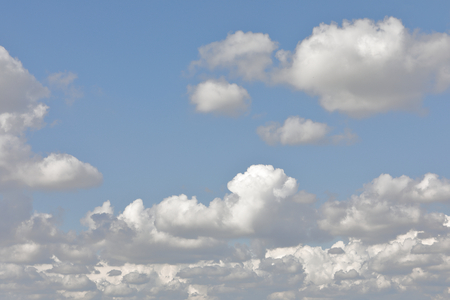clouds scattered in a blue skyの写真素材