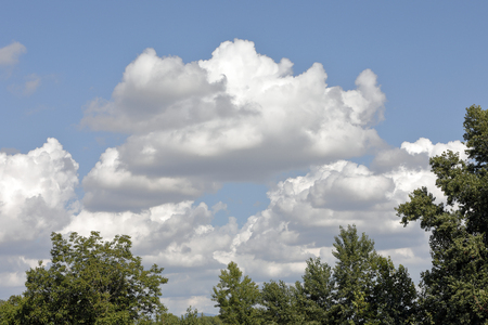 clouds scattered in a blue skyの写真素材