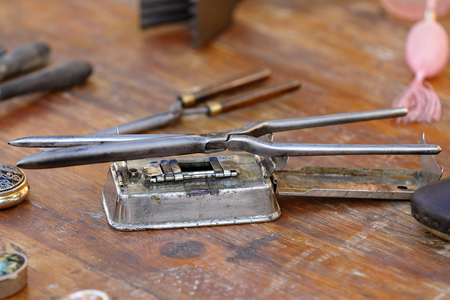 old metal plate with for to stretch the hairの写真素材