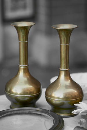 Two vintage brass vases on black and white backgroundの写真素材