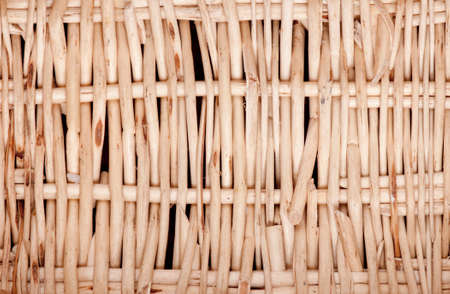 Detail of a roughly woven basket made from willow twigs.の写真素材