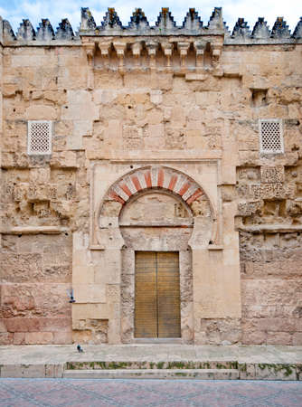Exterior arched entrance door to the  Mezquita. Popular tourist destination in Spain.のeditorial素材