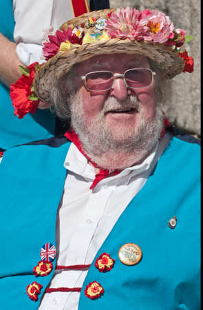 SEGOVIA  SPAIN - MARCH 16 2014 - East Suffolk Morris Mand in the ancient Roman city of Segovia, Spain with blue and white uniform, bells and straw hats decorated with flowers.   のeditorial素材