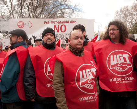 MADRID SPAIN - MARCH 10: Demonstration taking place in central Madrid against the cuts in education, social benefits, salaries and health that have been imposed as solutions to the economic crisis. Comisiones de Obreros officials. This is part of simult MADRID SPAIN - MARCH 10: Demonstration taking place in central Madrid against the cuts in education, social benefits, salaries and health that have been imposed as solutions to the economic crisis. Comisiones de Obreros officials. This is part of simult
