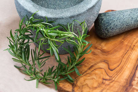 olive wood grey mortal and green herbsの写真素材