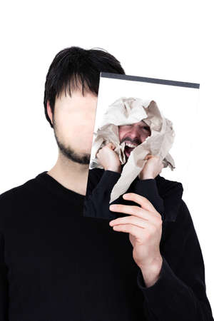 symbolic image of a man holding his face 