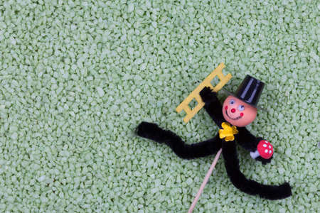 Chimney sweep luck plug with green pepples backgroundの写真素材
