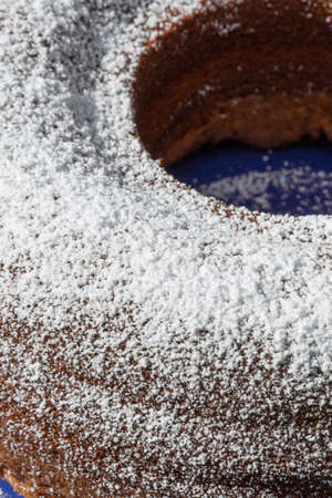 chocolate, nut, sponge cake sprinkled with icing sugarの写真素材