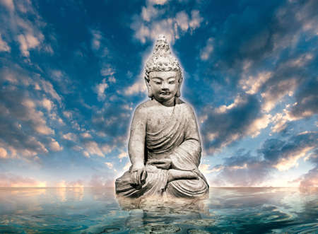 Buddha statue on waterの写真素材